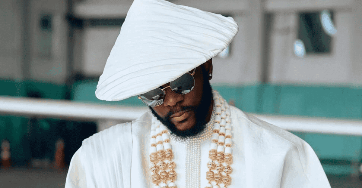 Ebuka Obi-Uchendu in white Ugo Monye outfit with coral beads on BBNaija stage