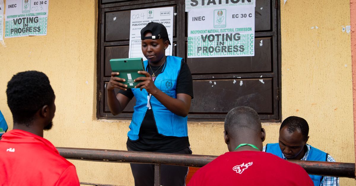 INEC officials testing BVAS machines at a polling unit in Osun State.