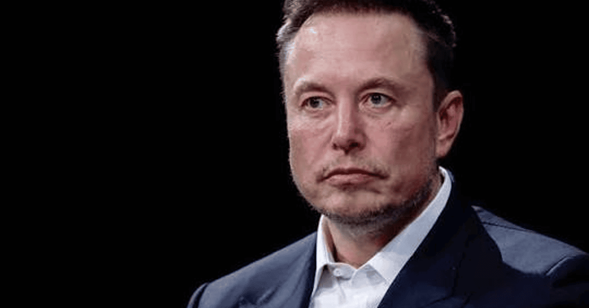Elon Musk looking at a smartphone with AI chatbot interface