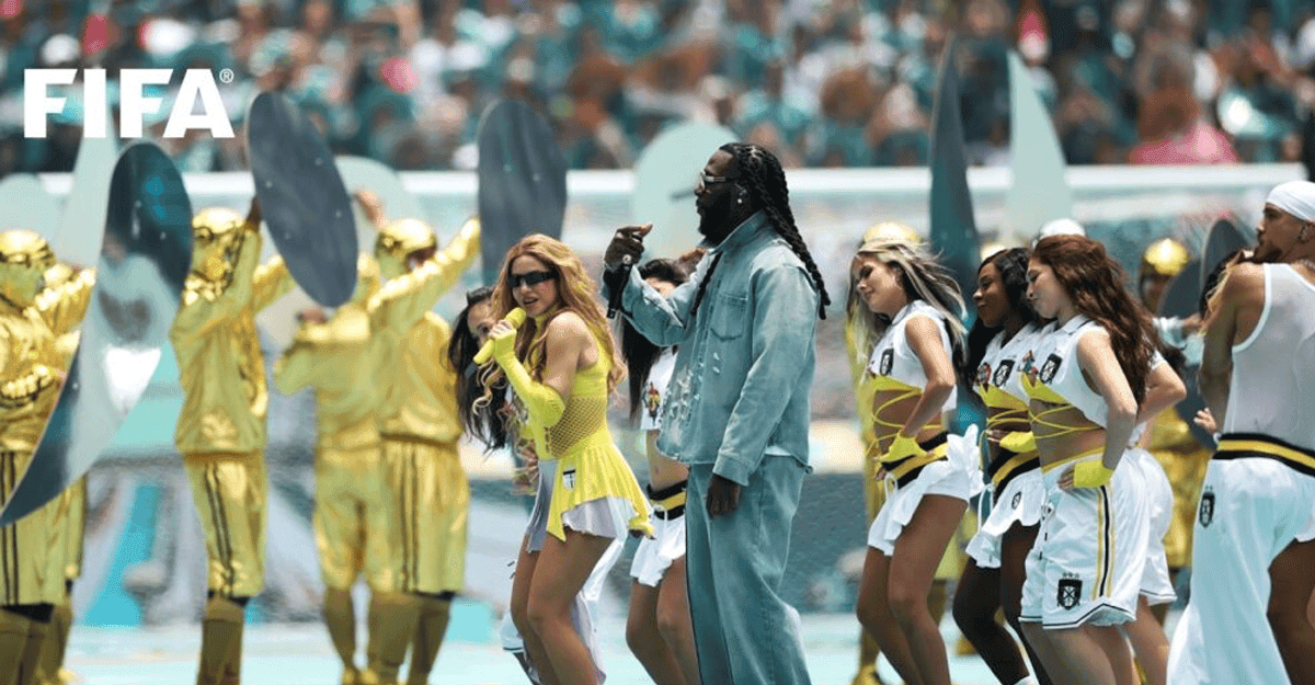 Nigerian artist performing on a football stadium stage