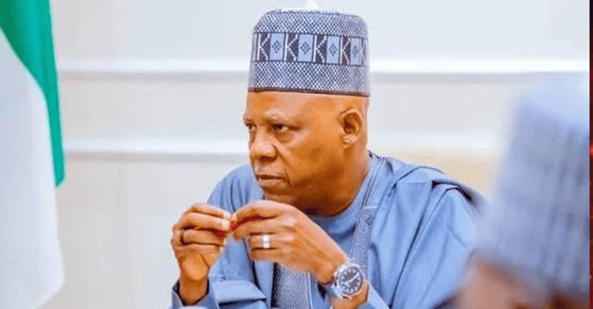 Vice President Shettima speaking at a podium in Jos, Nigeria