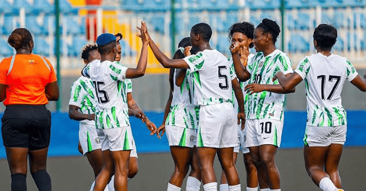Super Falcons players in green jerseys warming up at Al Madina Stadium in Rabat.