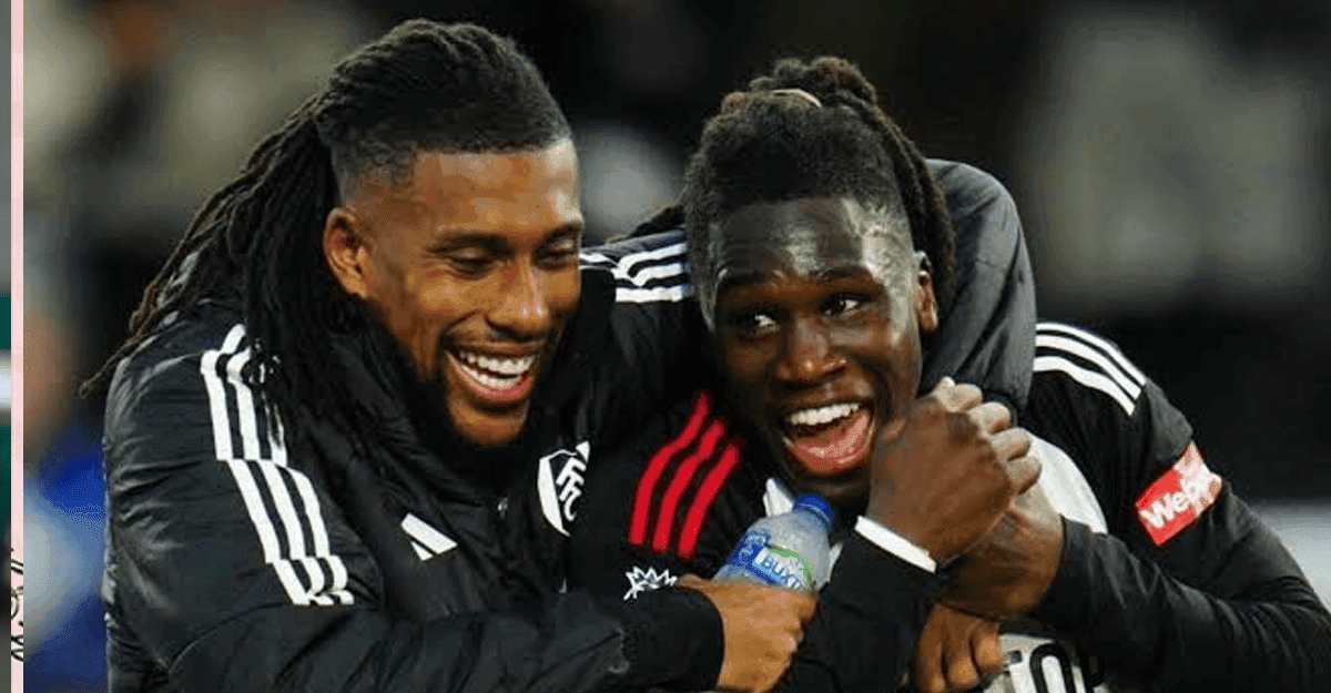 Alex Iwobi and Calvin Bassey in Fulham kits during a Premier League match.